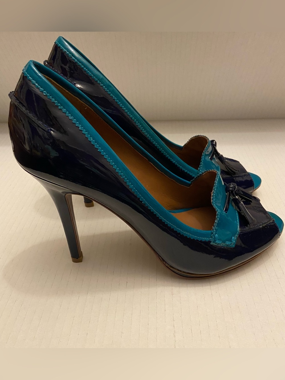 Donald J. Pliner Penni Tassel Color Block Navy and Teal Patent Peep-Toe Heels.